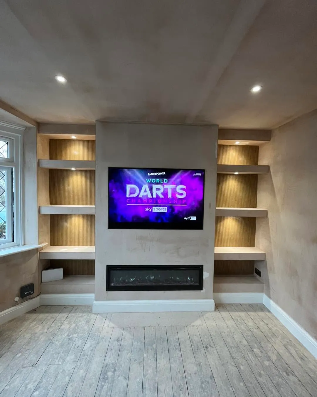 Bespoke cabinetry and media wall by Marriotts Carpentry